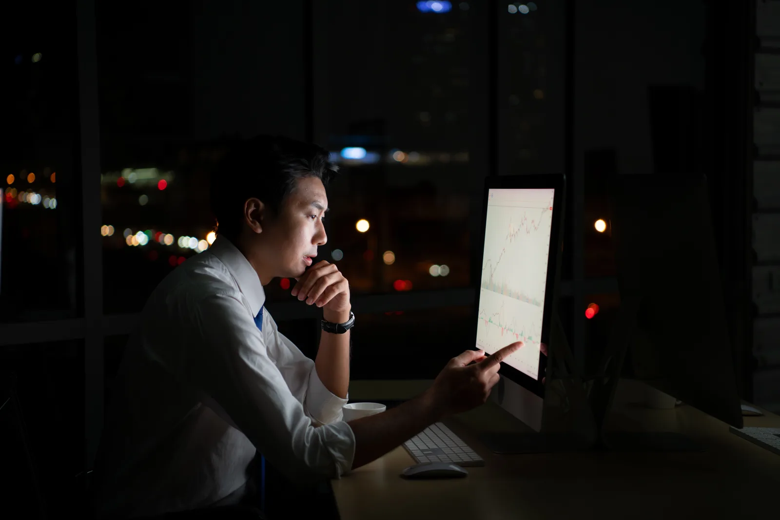 Analyst reviewing a performance chart