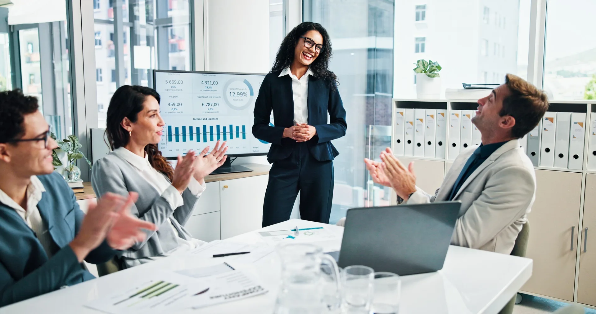 Business team discussing profitability results in a bright office
