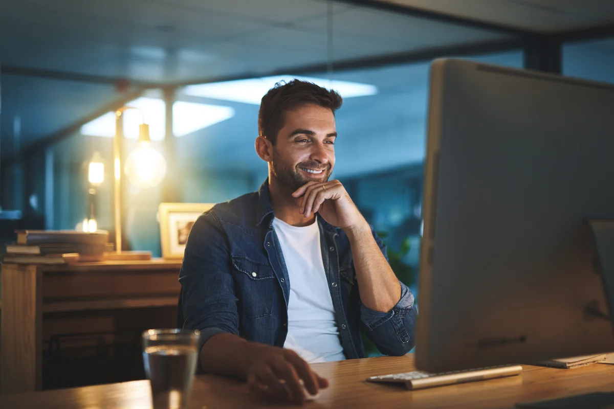 Business leader working at a desktop computer