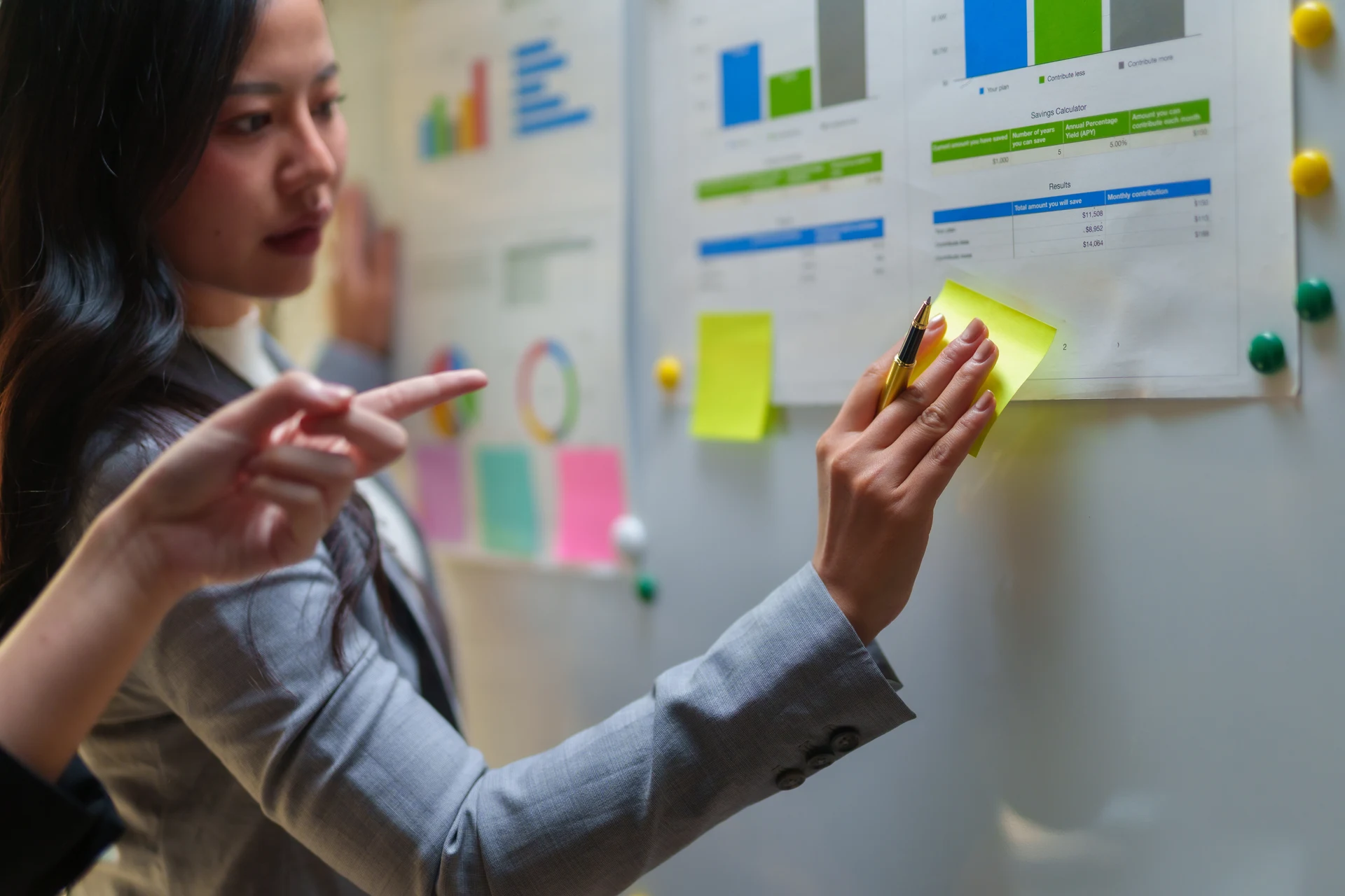 Analyst reviewing pricing figures and scenario notes